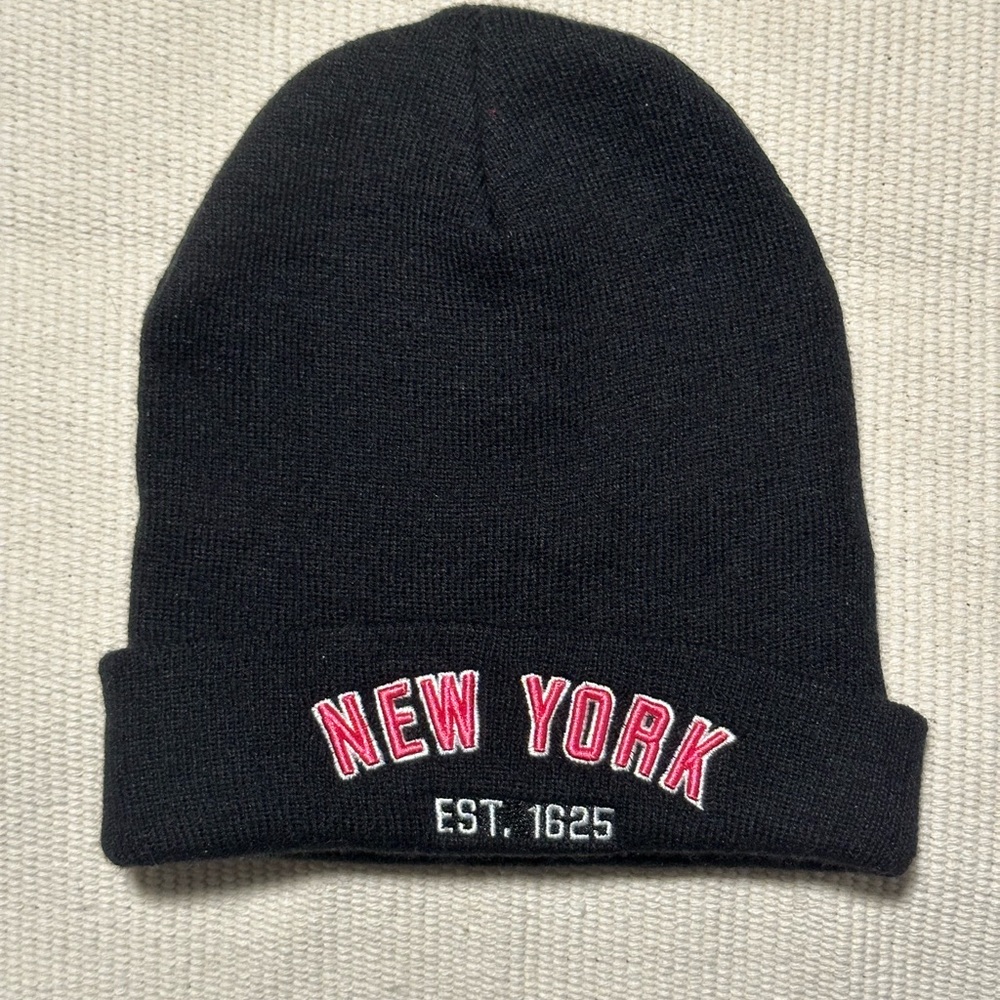 Embroidered pink, white, black New York beanie hat.